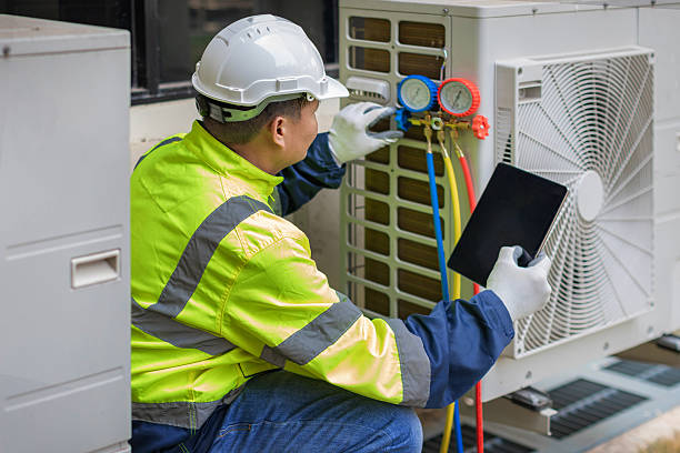 Professional Heat Pump Repair technician working in Oakwood, IL